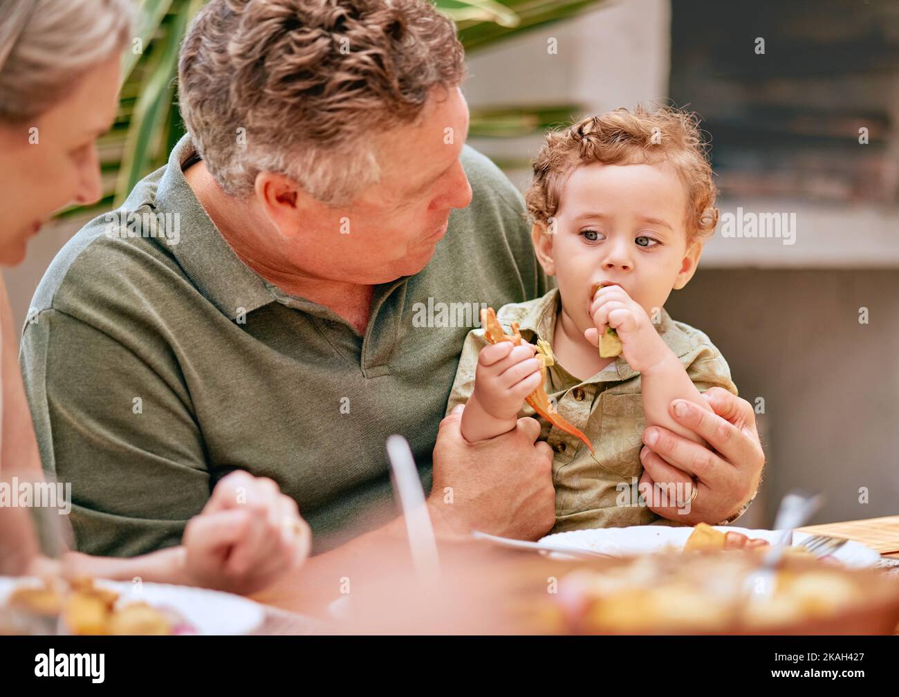 Family, lunch and grandparents have food with child at home for happy