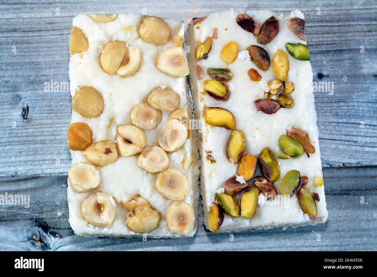 Arabian sweet candies of soft coconuts covered with pistachios and