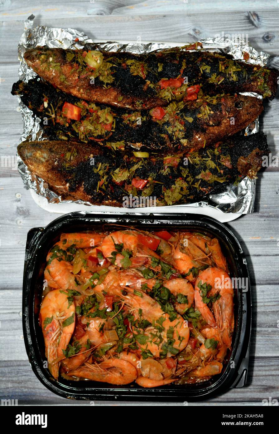 Seafood cuisine of Boiled shrimps mixed garlic, lemon, parsley, pepper