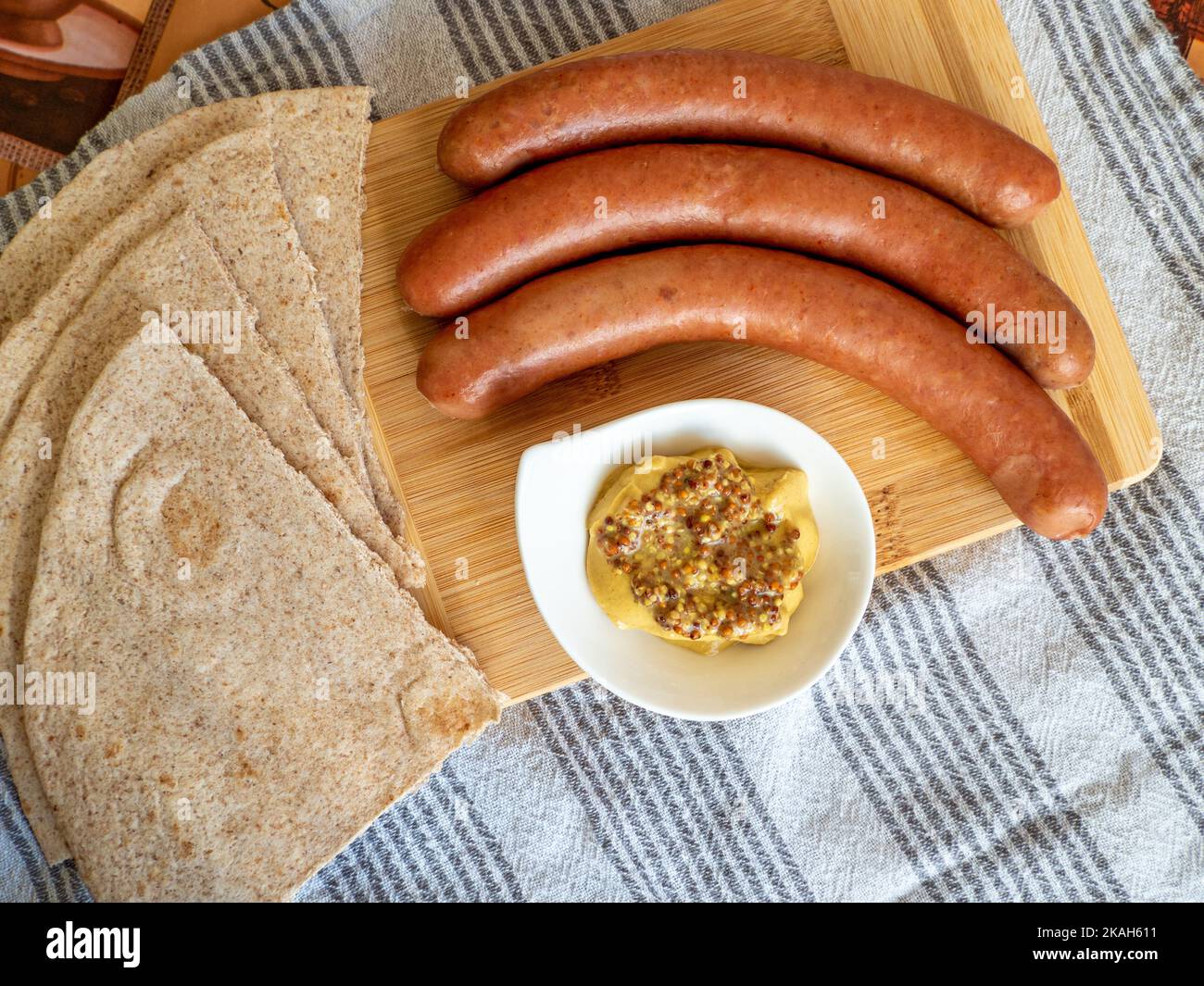 virstli, transylvanian sausages on a wooden board with mustard Stock Photo
