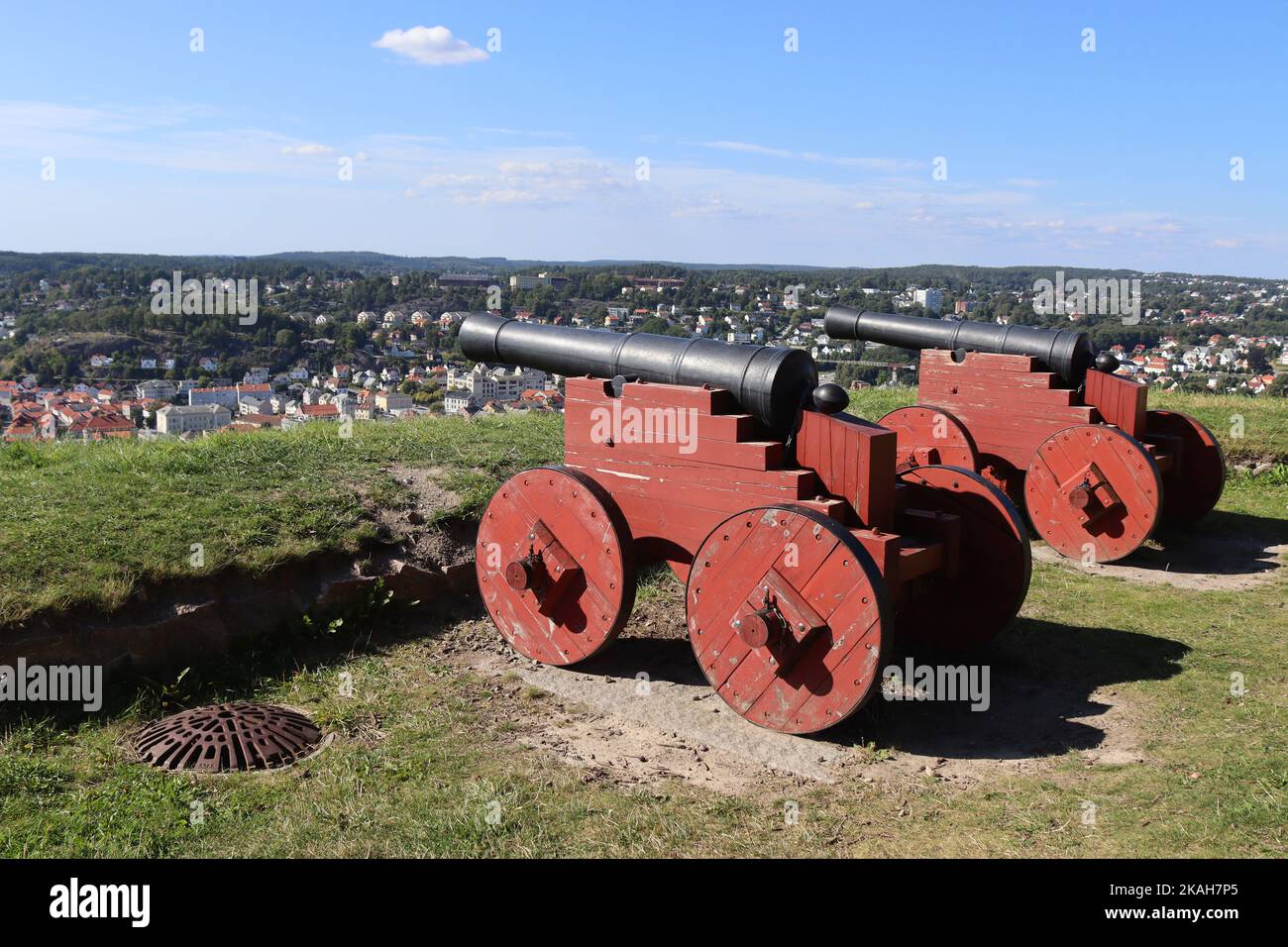 Two historic canons pointed towards Halden city from Fredriksten Fortress in Viken County, Norway. Copy space above. Stock Photo