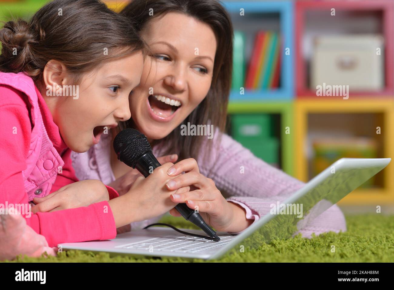 cute little girl lying on floor Stock Photo Alamy