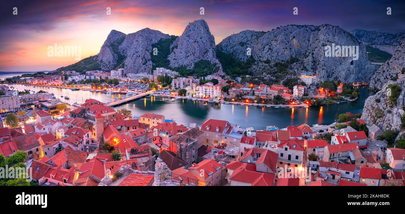 Omis, Croatia. Panoramic cityscape image of beautiful coastal town Omis, Dalmatia, Croatia at summer sunset. Stock Photo
