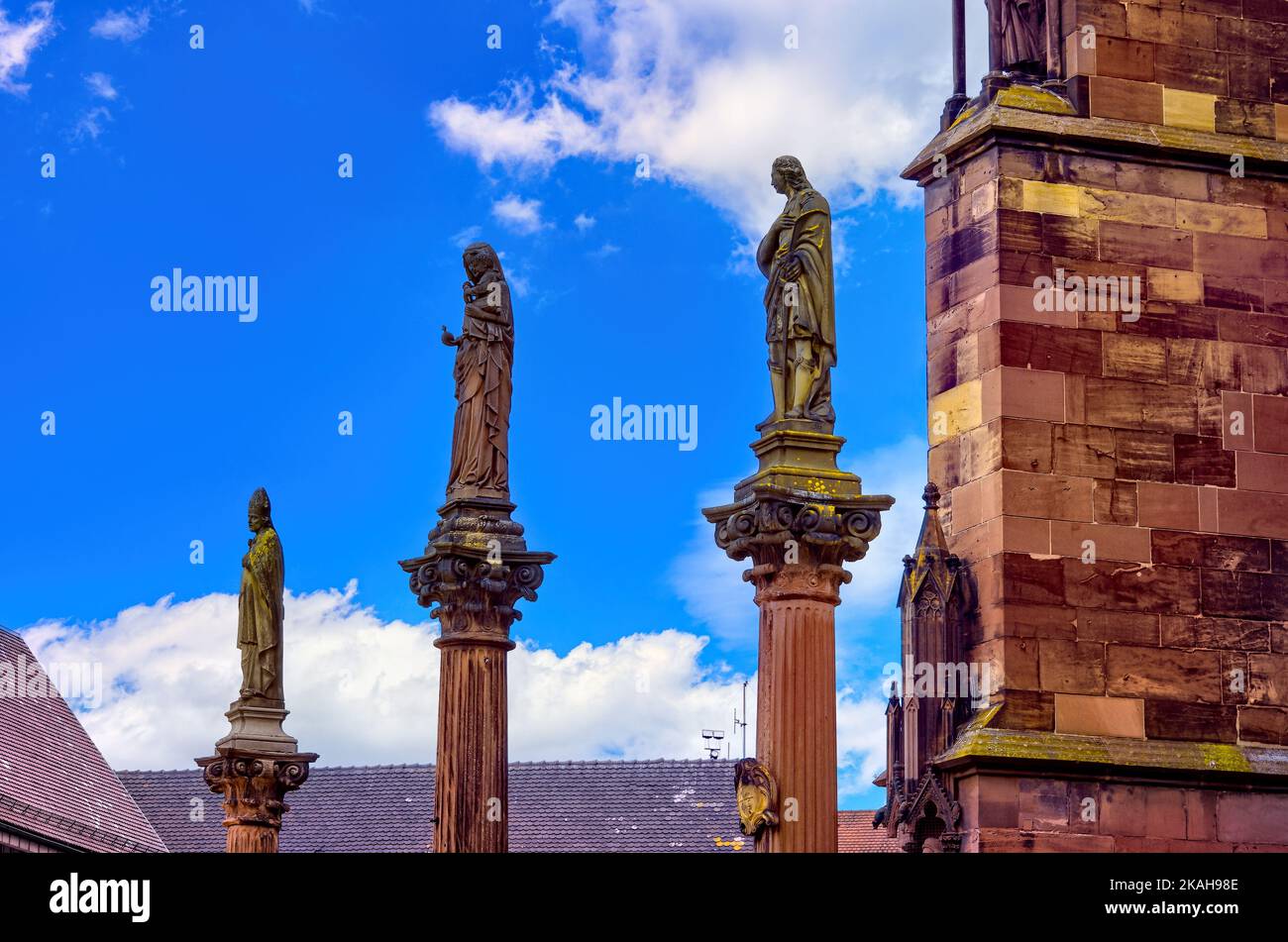 Plague pillars with patron saints in front of the main portal of the Freiburg Minster on Minster Square in the historic Old Town of Freiburg, Germany. Stock Photo