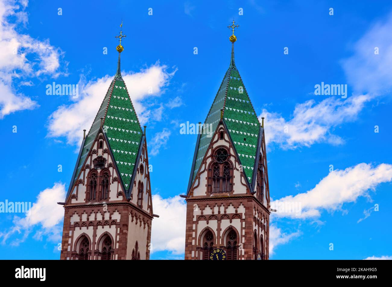 Two steeples, the twin towers of the Church of the Sacred Heart in Freiburg im Breisgau, Baden-Wurttemberg, Germany, Europe. Stock Photo