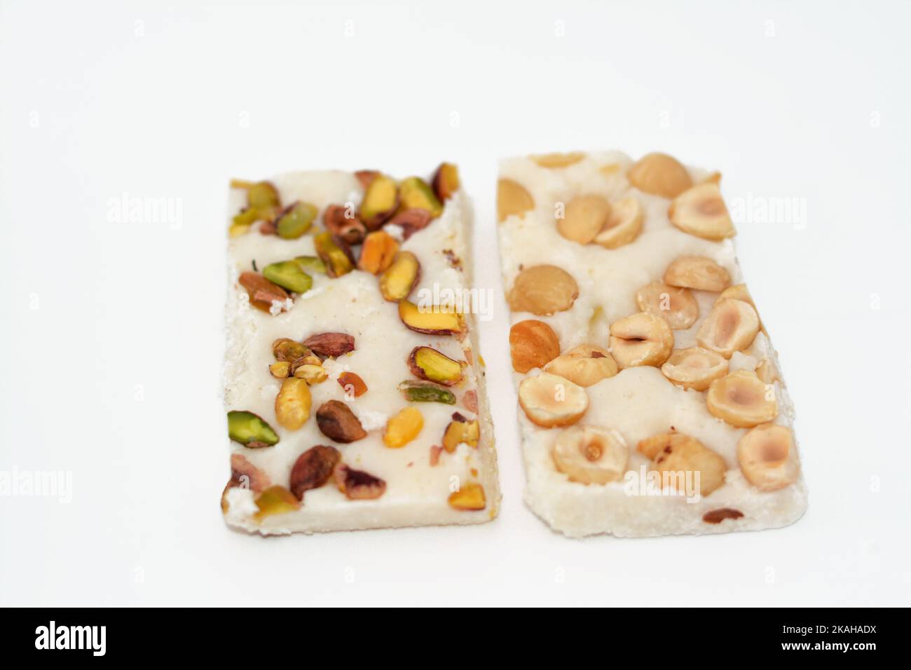 Arabian sweet candies of soft coconuts covered with pistachios and ...
