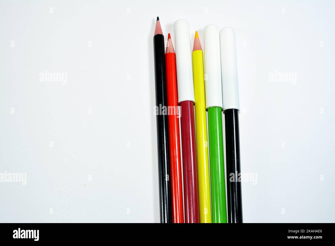 watercolor pens and wood pencils of different colors for painting