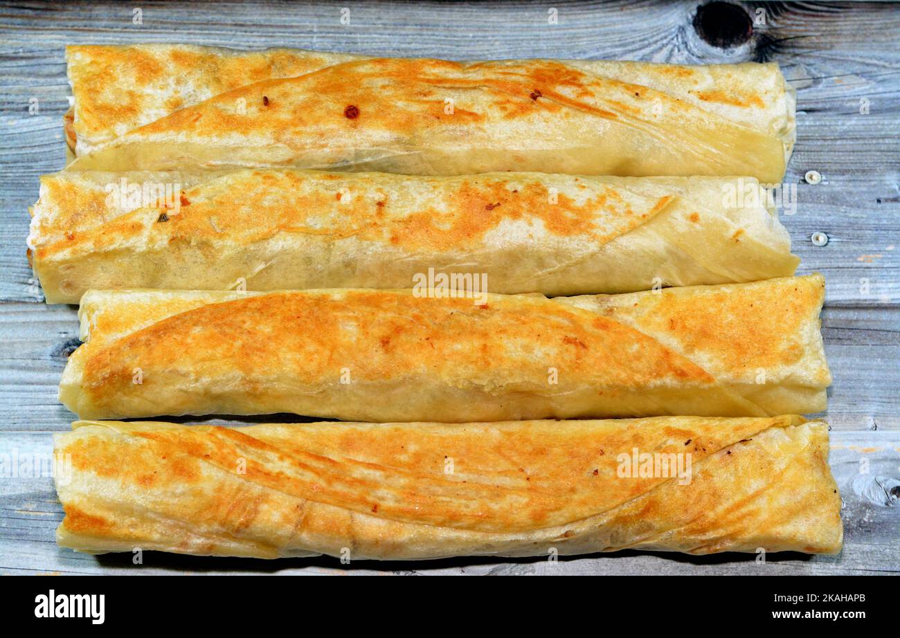 Syrian recipe cuisine background, chicken shawerma or shawarma tortilla