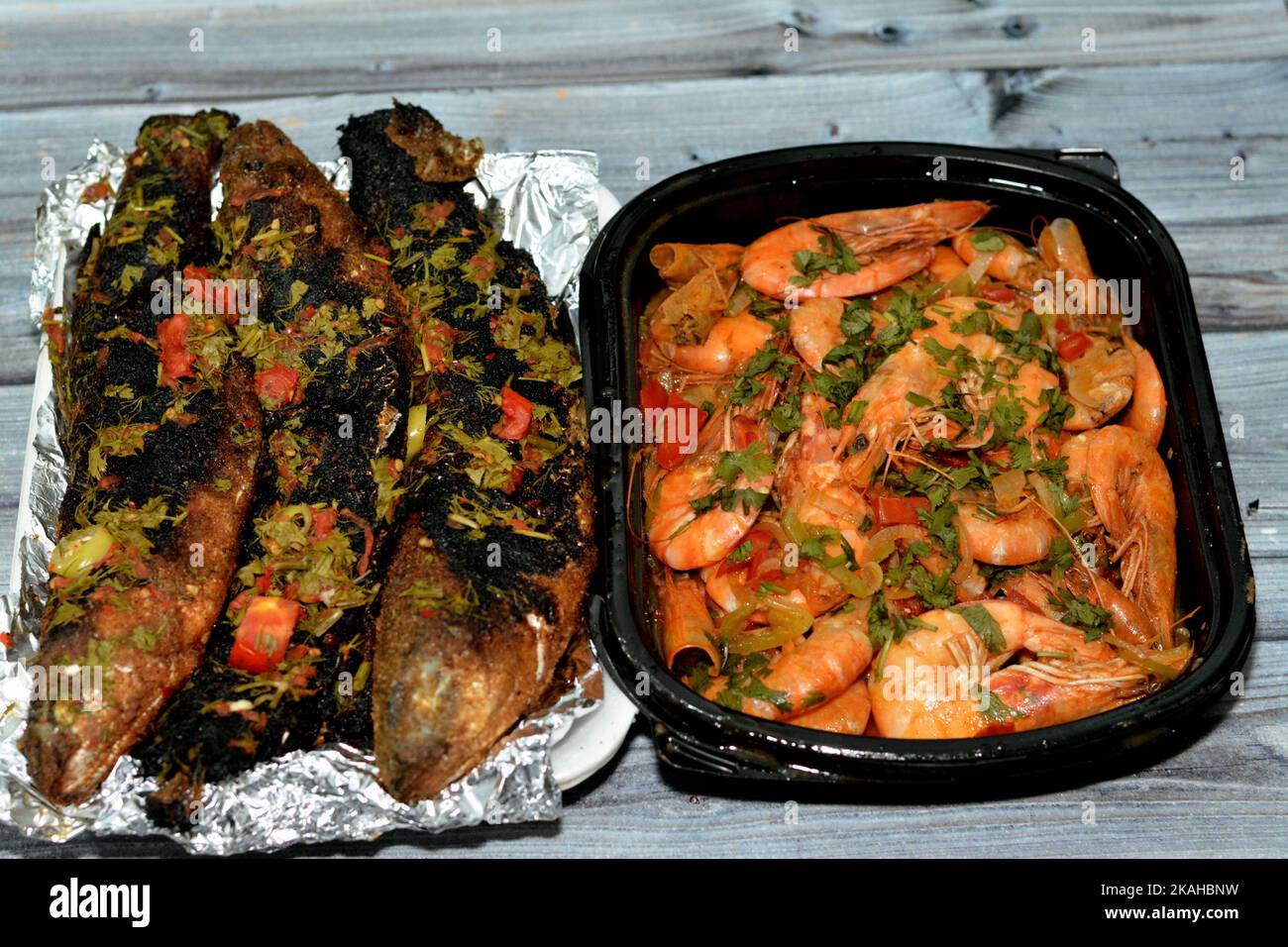 Seafood cuisine of Boiled shrimps mixed garlic, lemon, parsley, pepper