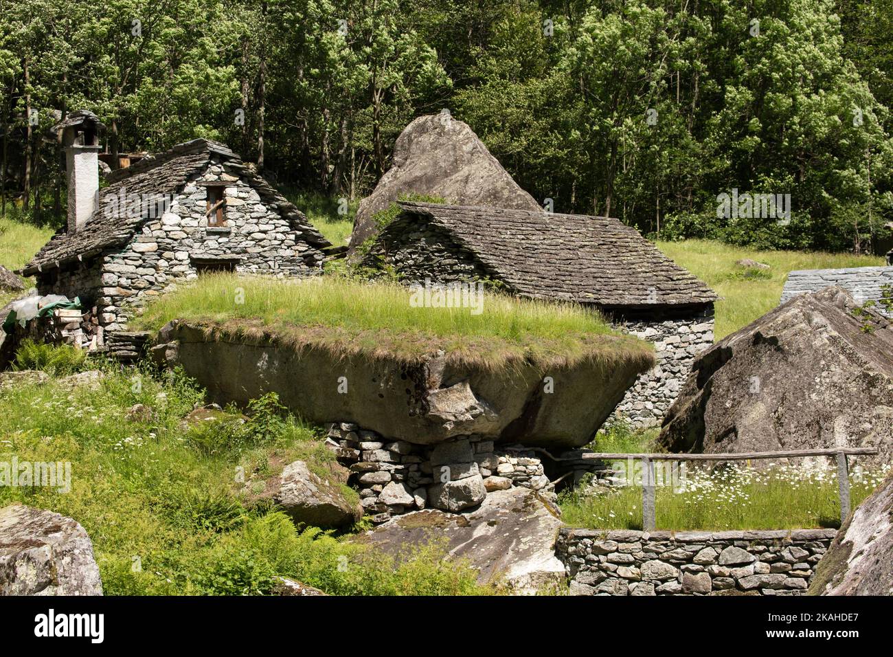 Old stone houses, called Rustico, in Puntid high above the Bavona Valley in Ticino Switzerland. Stock Photo