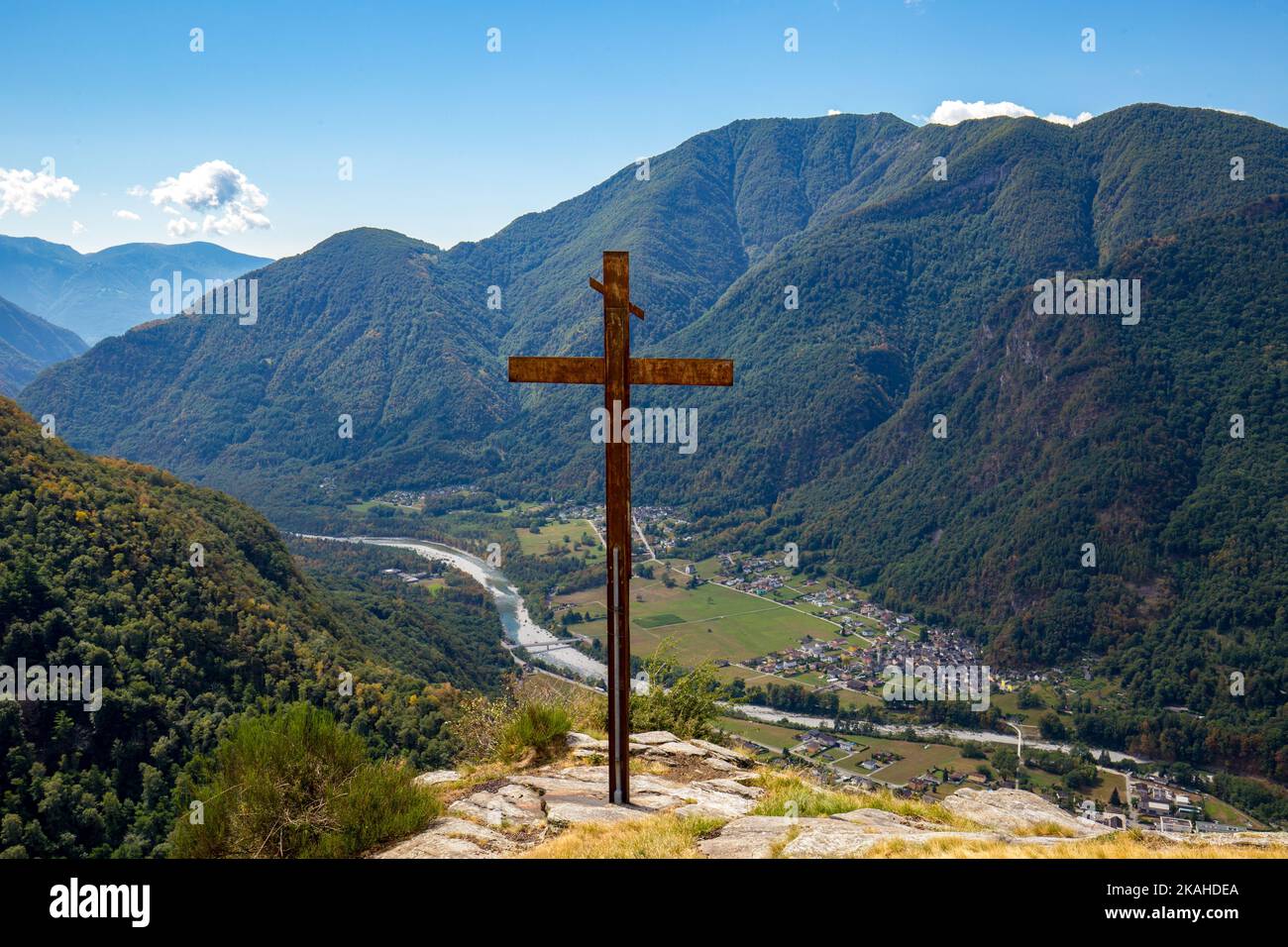Picturesque vantage point with dominant steel cross high above the Valle Maggia in Switzerland. Stock Photo