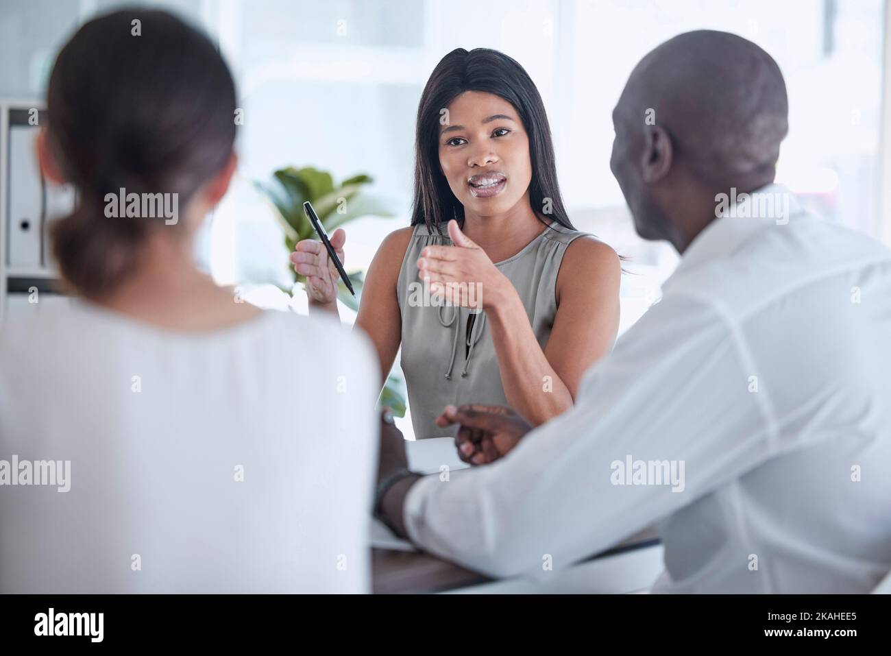 Business meeting, discussion and black woman in leadership for goal, planning and talking about growth strategy for company mission. Man and women Stock Photo