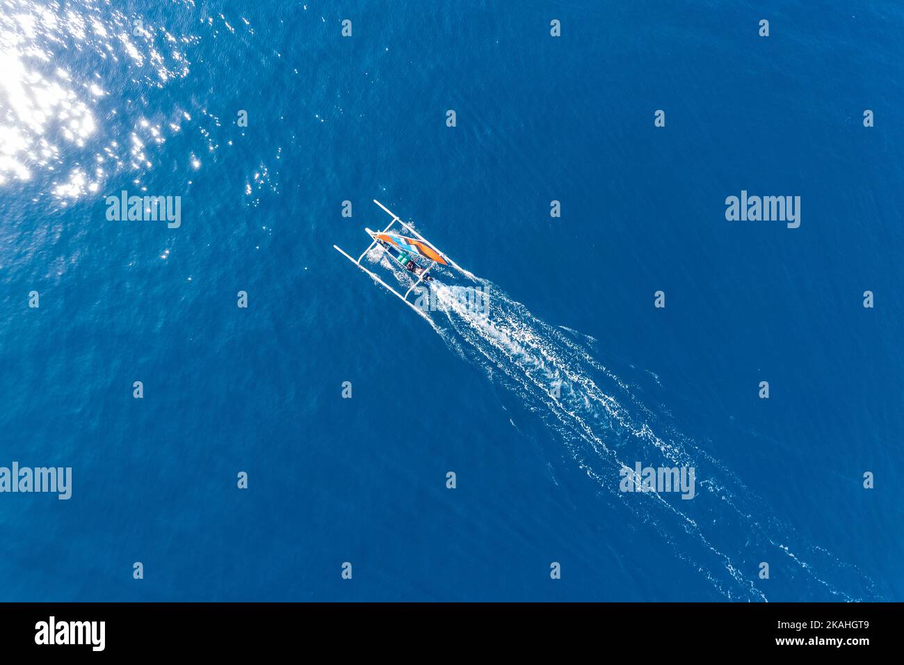 Aerial view of a traditional fishing boat sailing in ocean, Lombok, West Nusa Tenggara, Indonesia Stock Photo