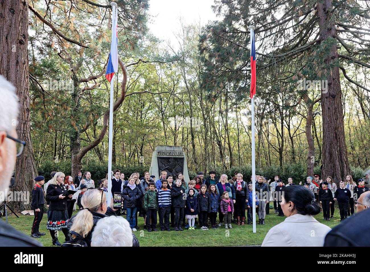 Children of the UK Czech & Slovak Schools Sing Their National Anthem at a Remembrance Service at their National Monument Stock Photo