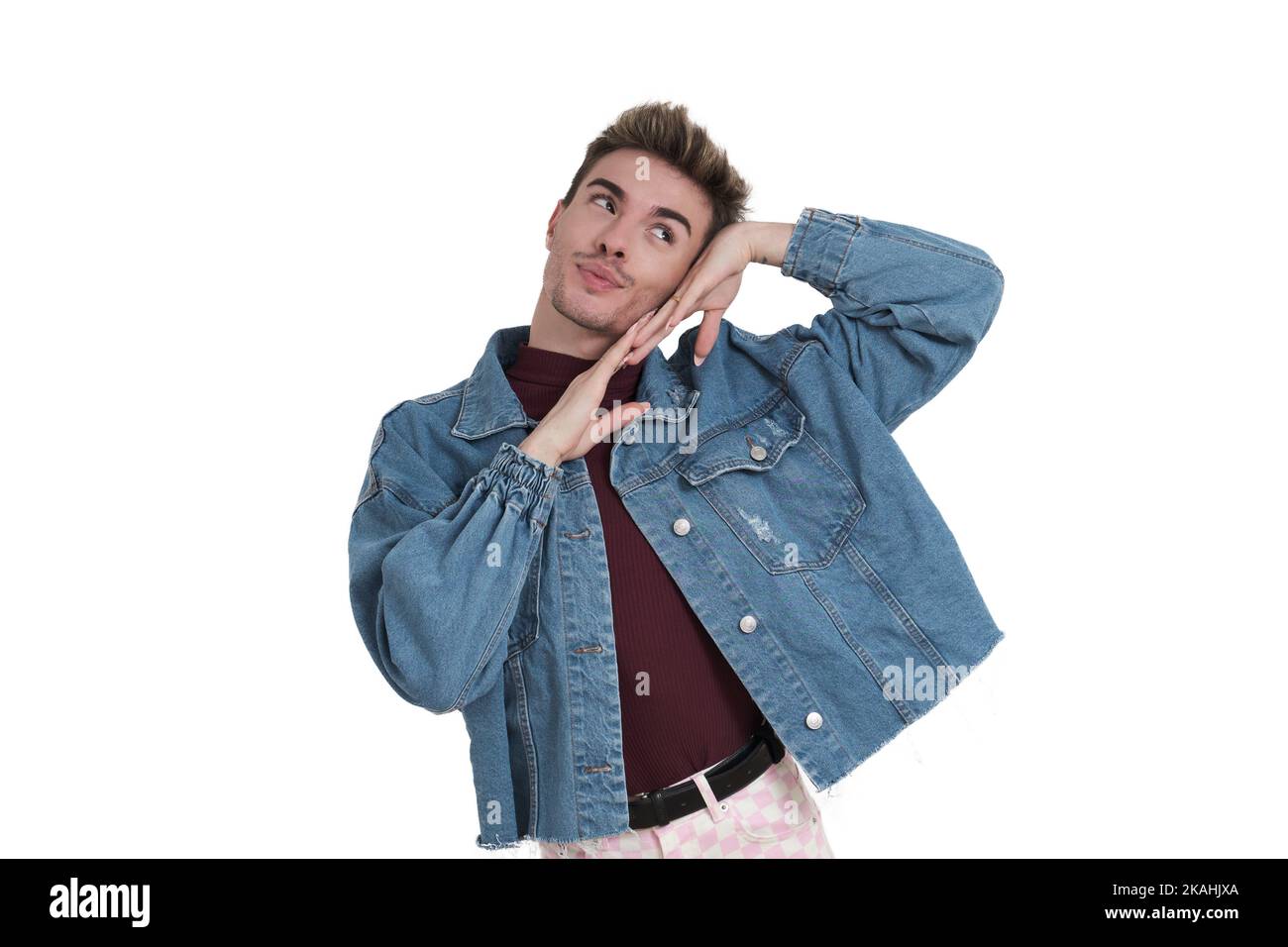 Young caucasian man smiling with his hands on his face, isolated. Stock Photo