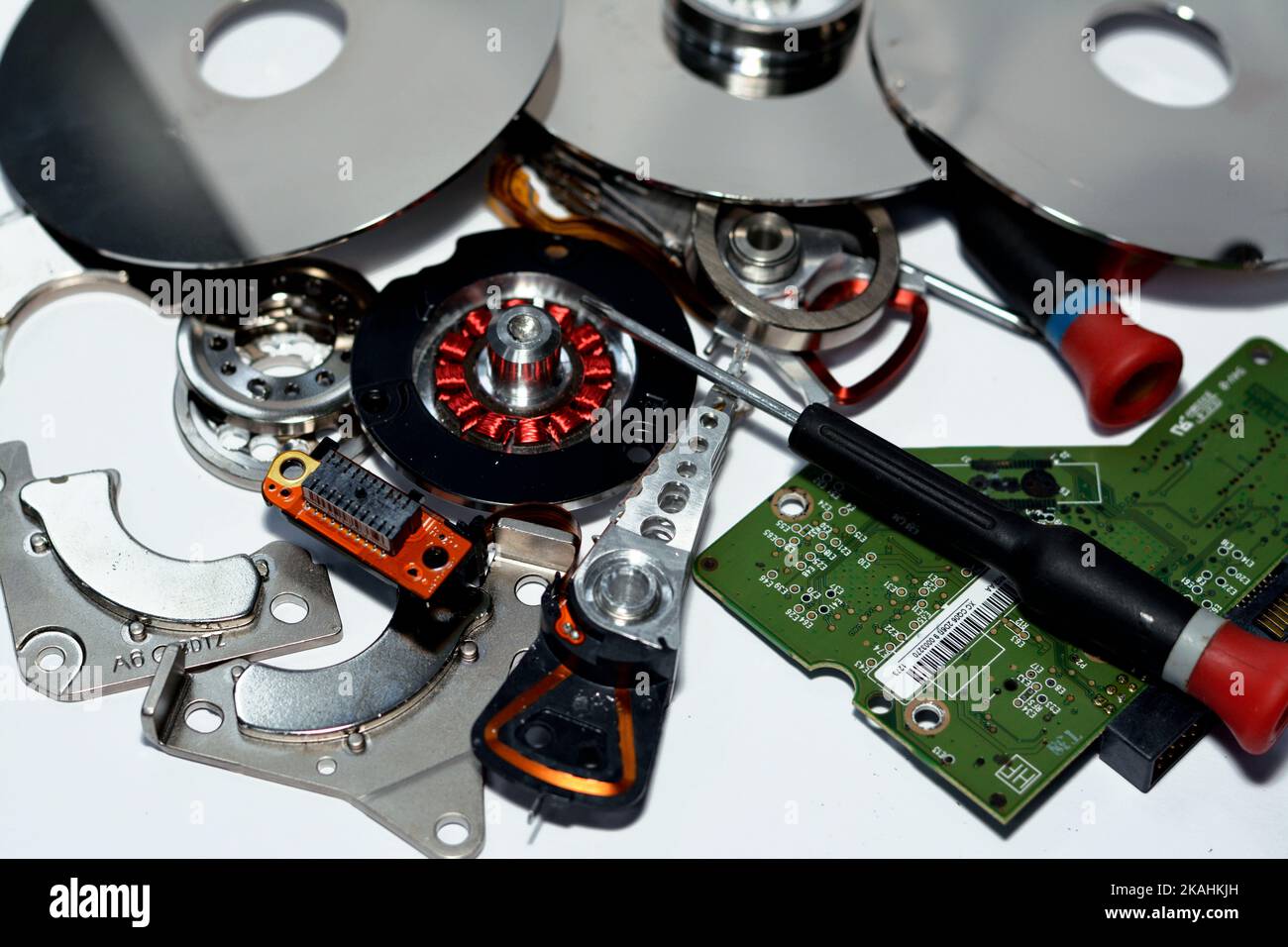 Damaged Hard disk drive components with disks, read write head, spindle