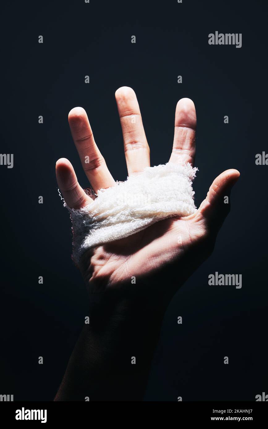 Bandage, black and hand palm of man with medical injury pain, first aid
