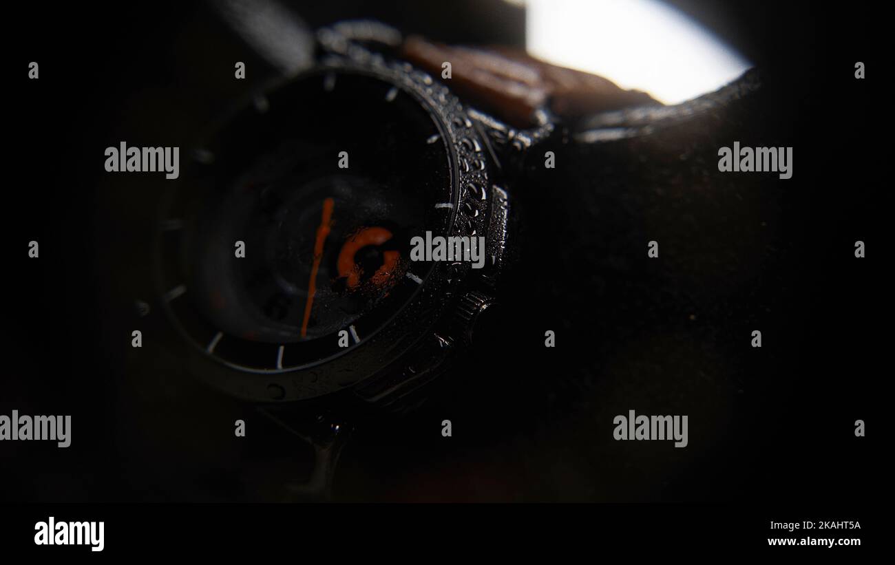 Wrist watch with water particles on it with blurry look extreme close-up, background concept Stock Photo