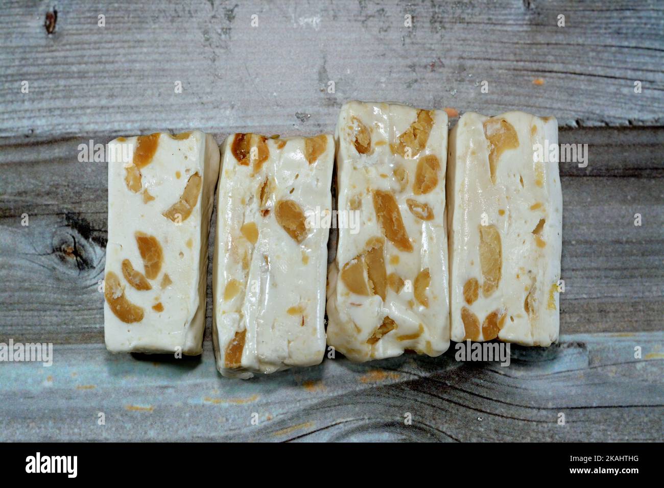 Pieces of Arabic sweet delicious Noga with peanuts,Egyptian cultural desserts of prophet