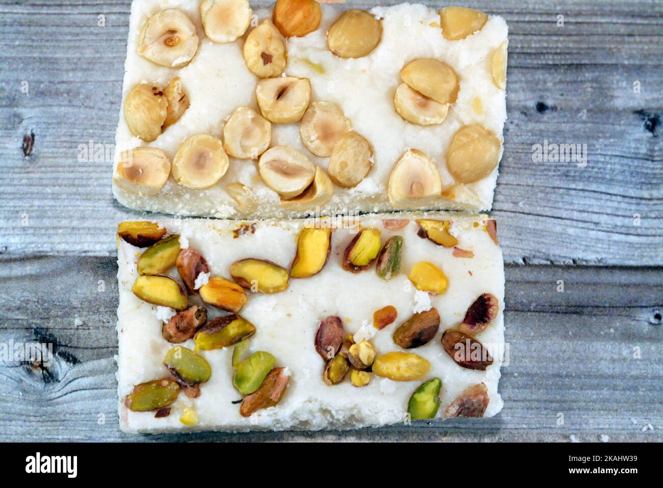 Arabian sweet candies of soft coconuts covered with pistachios and