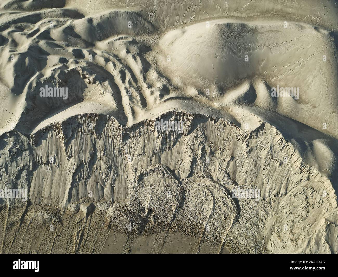 open pit mine and selection of raw materials and minerals extracted from the ground Stock Photo