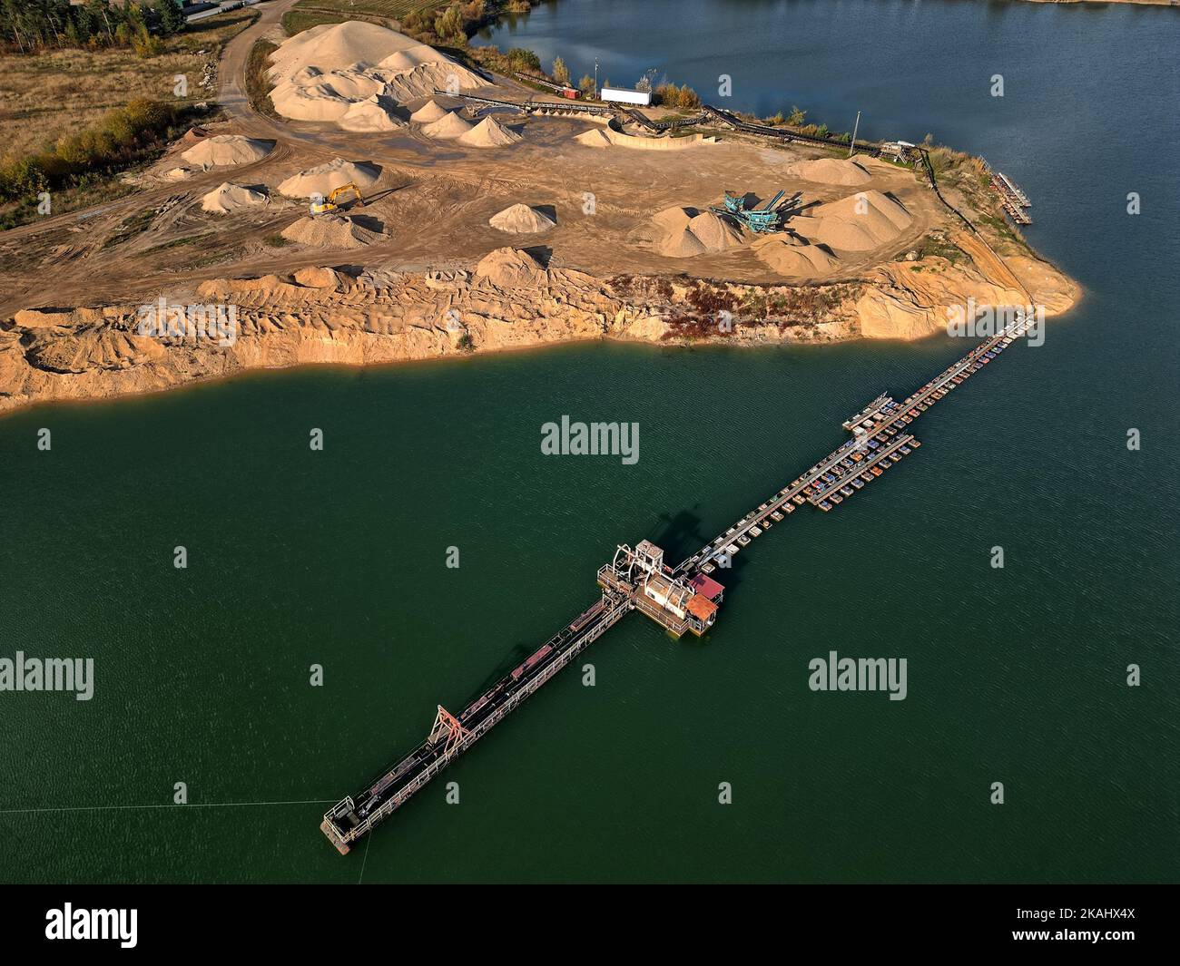 open pit mine and selection of raw materials and minerals extracted from the ground Stock Photo