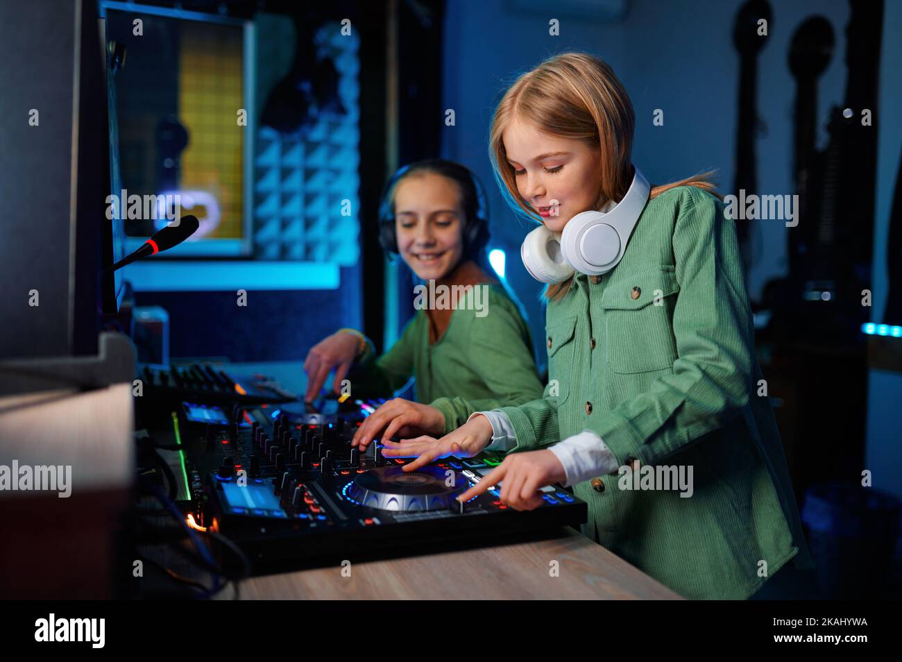 Children using sound mixer in radio station Stock Photo Alamy