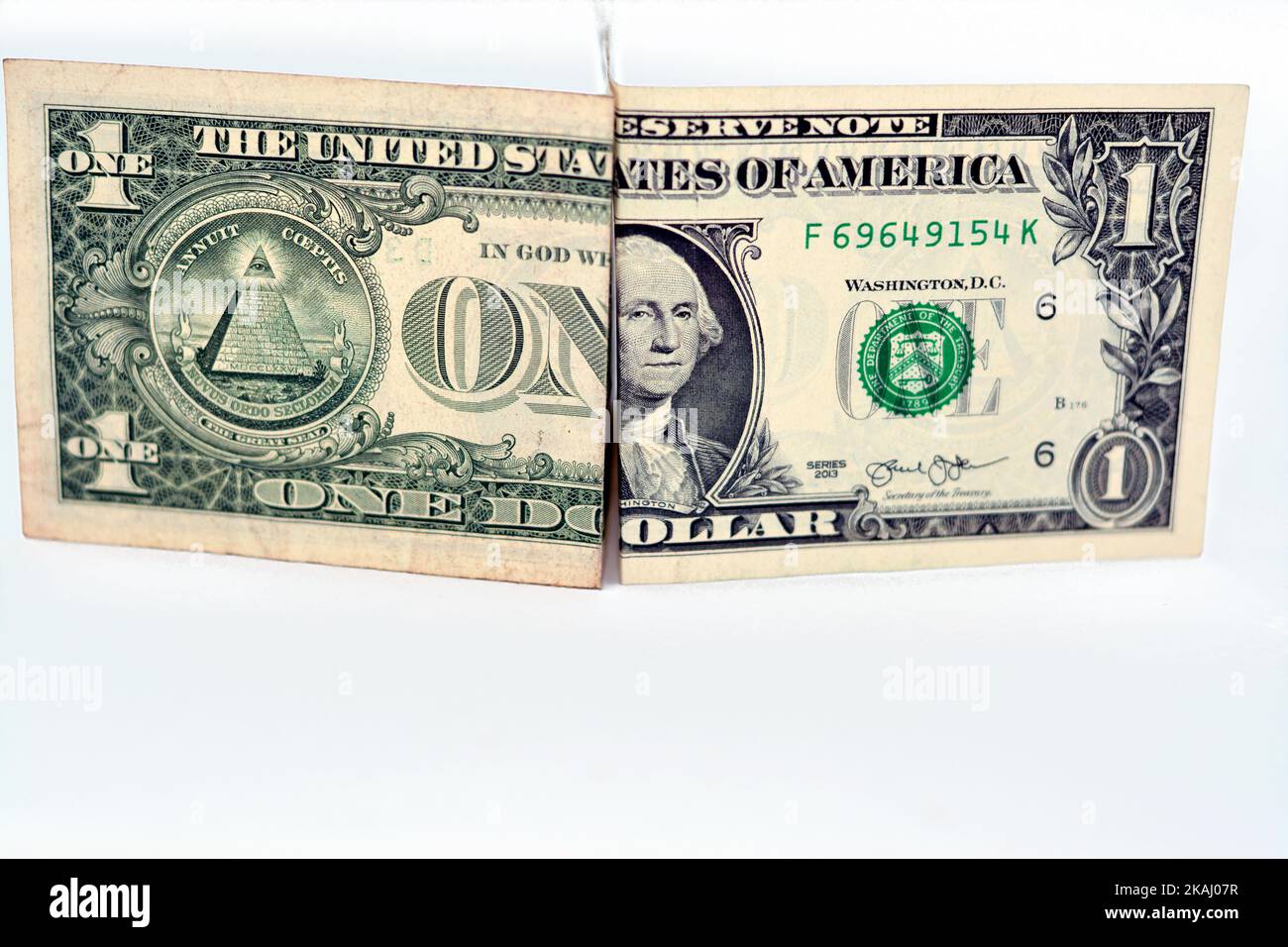 Part of obverse and reverse sides of 1 $ one American dollar cash money banknote bill half and half isolated on white background, money background exc Stock Photo