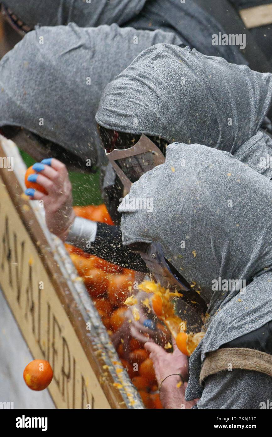 orange throwers on horsedrawn carts hit by the oranges throwed by