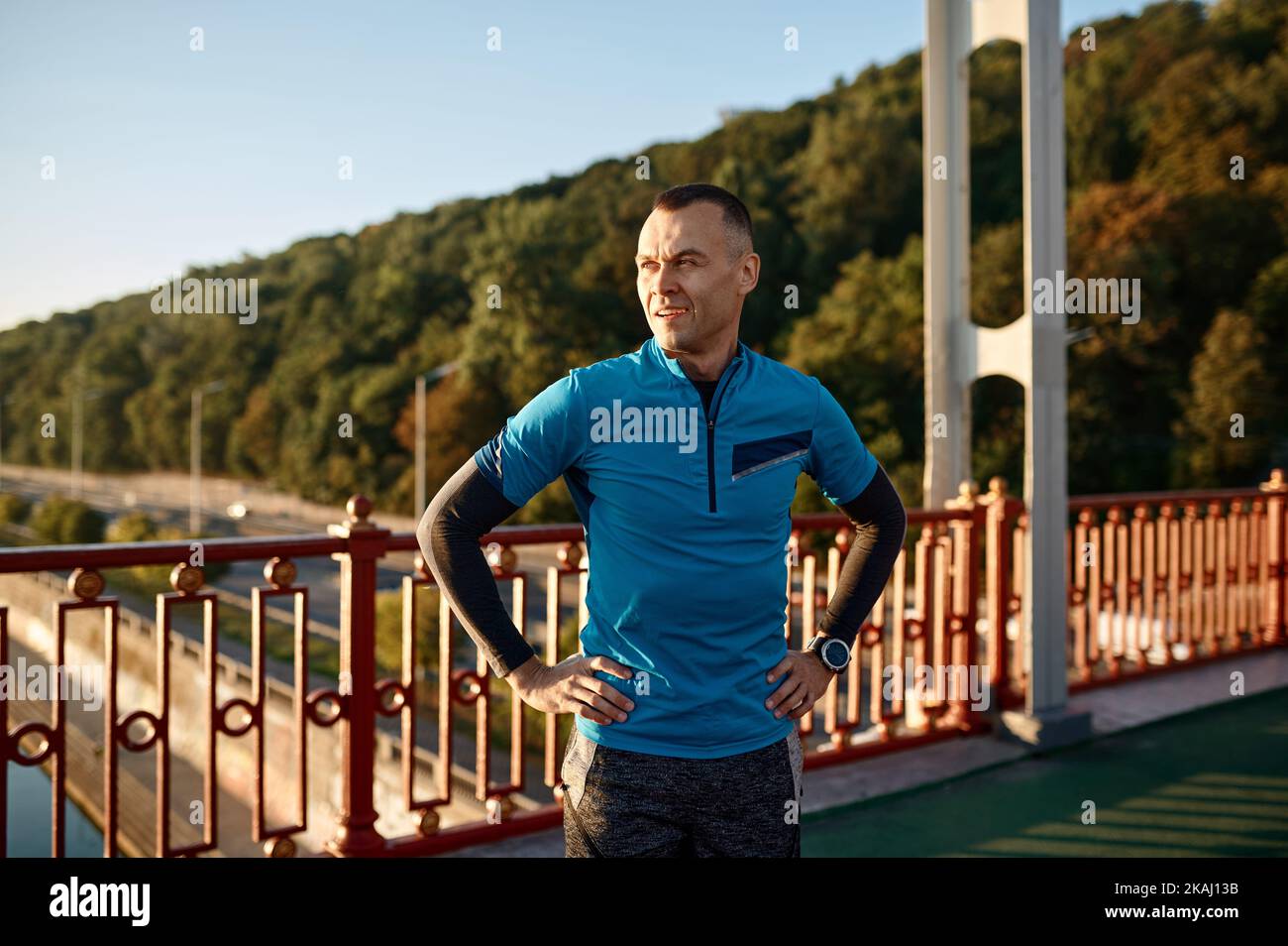 Mature runner breathing hard takes break after jogging Stock Photo Alamy