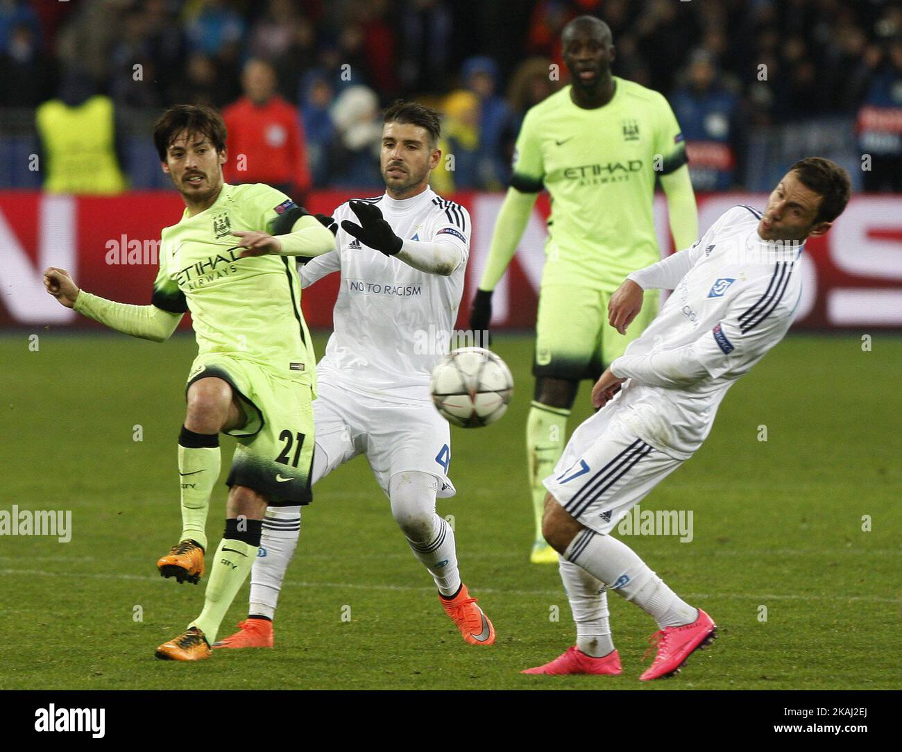 Miguel Veloso (C) and Serhiy Rybalka (R) of Dynamo vies for the ball with David Silva  (L) of Manchester City,during the UEFA Champions League 16 round, first leg soccer match between Dynamo Kyiv and Manchester City at the Olimpiyskiy stadium in Kiev, Ukraine, on 24 February 2016. (Photo by STR/NurPhoto) *** Please Use Credit from Credit Field *** Stock Photo