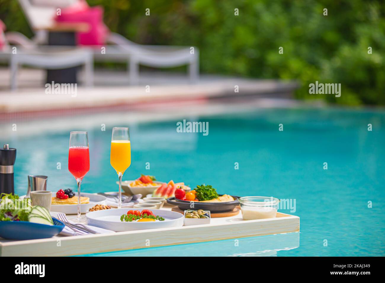 Breakfast tray in swimming pool, floating breakfast in luxury hotel