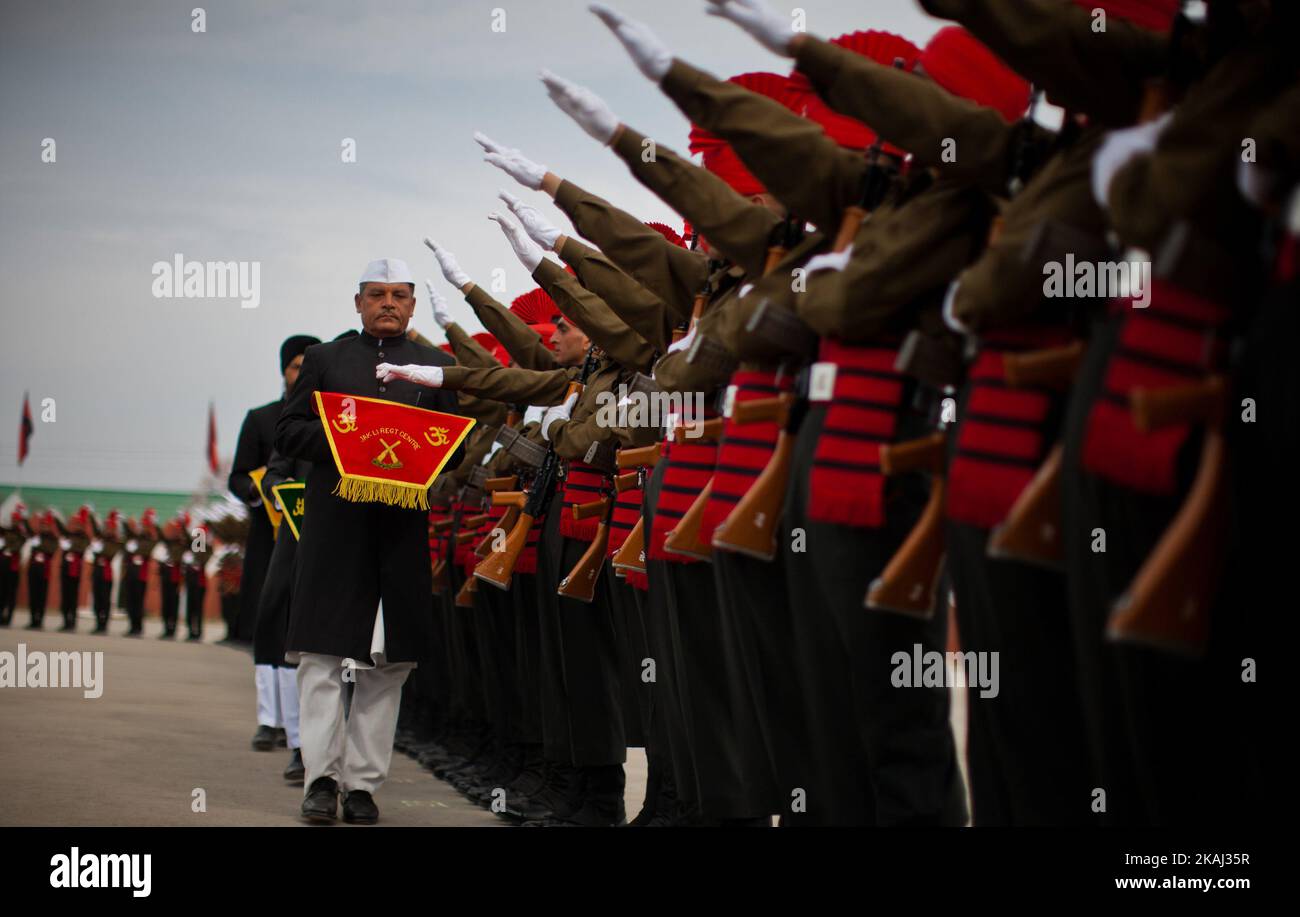 Recruits of the Indian army from Kashmir stamp their feet during their passing out parade at a garrison in Rangreth on March 05, 2016 in the outskirts of Srinagar, the summer capital of Indian-controlled Kashmir, India. Over 240 Kashmiri men took an oath during their passing out parade after successfully completing 49 weeks of arduous training which involved, weapons handling, map reading and counter-insurgency operations. The recruits will join Indian army's Jammu and Kashmir Light Infantry Regiment (JAK LI) to fight militants in Kashmir, a spokesman of the army said. India has already close  Stock Photo