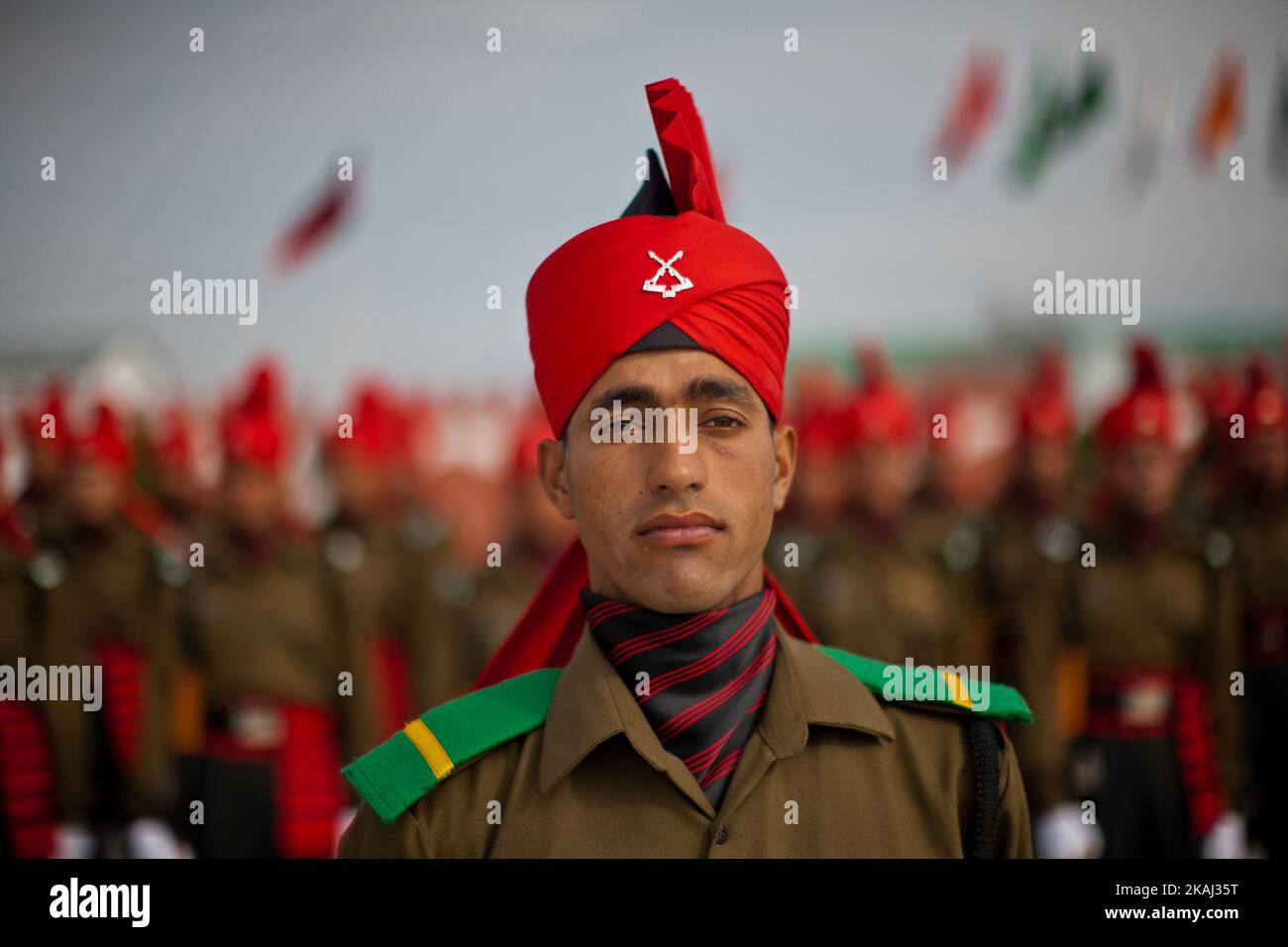 Recruits of the Indian army from Kashmir stamp their feet during their passing out parade at a garrison in Rangreth on March 05, 2016 in the outskirts of Srinagar, the summer capital of Indian-controlled Kashmir, India. Over 240 Kashmiri men took an oath during their passing out parade after successfully completing 49 weeks of arduous training which involved, weapons handling, map reading and counter-insurgency operations. The recruits will join Indian army's Jammu and Kashmir Light Infantry Regiment (JAK LI) to fight militants in Kashmir, a spokesman of the army said. India has already close  Stock Photo