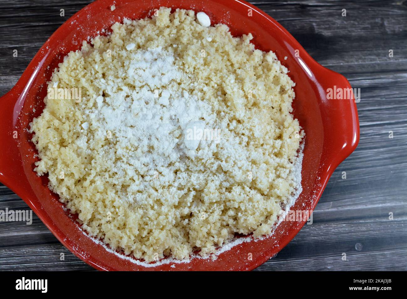 Arabian Cuisine dish of small steamed granules of rolled durum wheat semolina called Koskosi, couscous, kusksi or kseksu, popular in Morocco, Algeria, Stock Photo