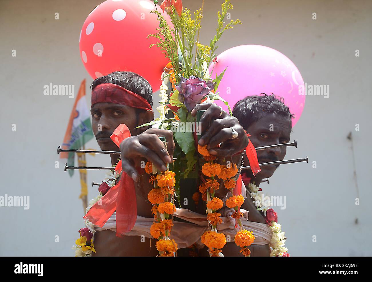 Hindu devotees are pierced with nail to a cross during the annual Shiva