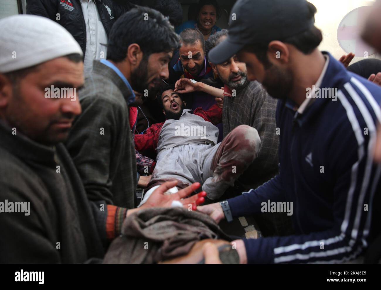 Kashmiri people take a wounded person to a local hospital in Srinagar, summer capital of Indian-controlled Kashmir, April 15, 2016. A teenager was killed and several others wounded Friday after army troops fired on civilians during protests in Indian-controlled Kashmir, officials said. (Xinhua/Javed Dar) ****Authorized by ytfs****  (Photo by Xinhua) Stock Photo