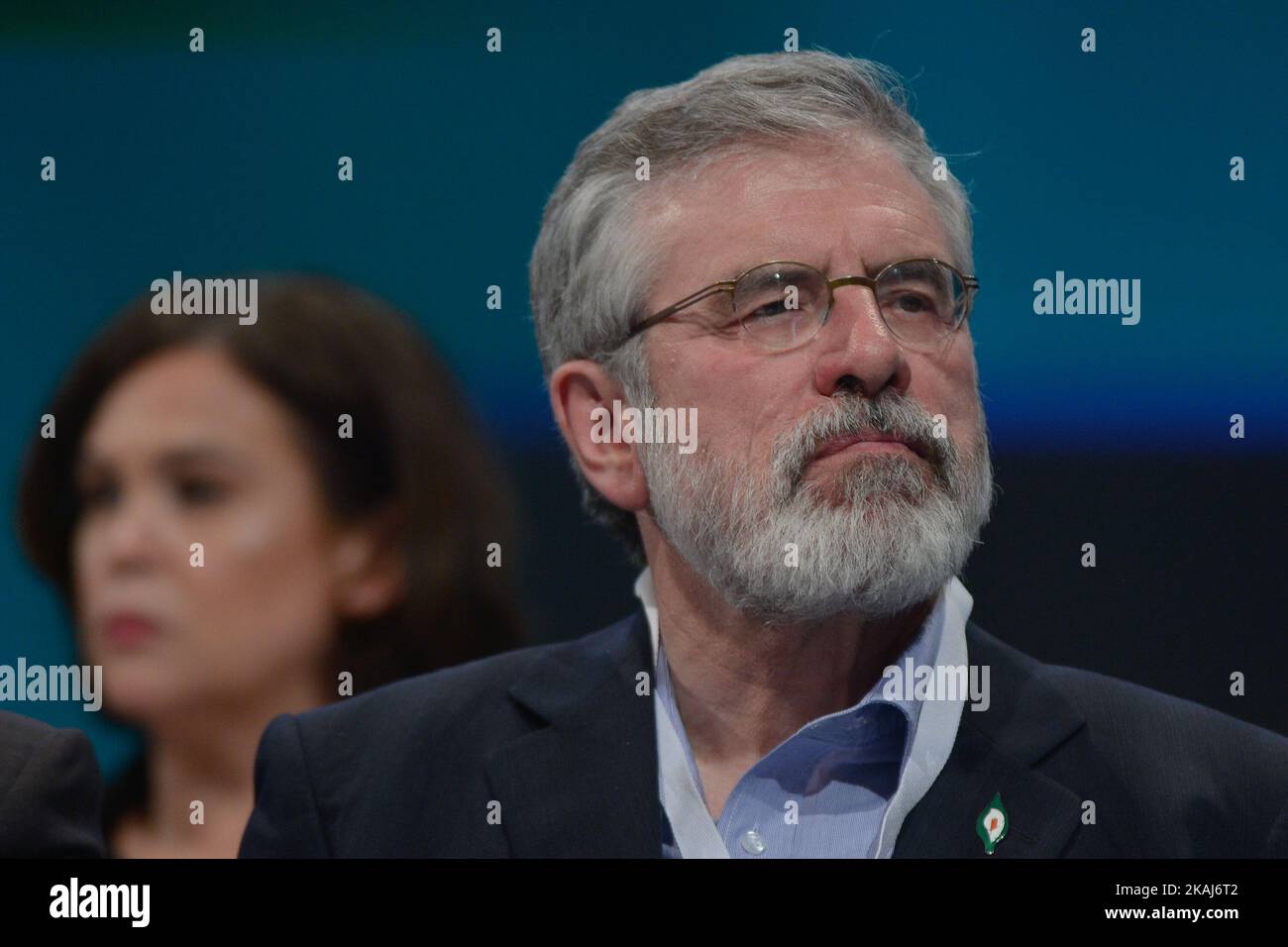 The Sinn Fein party's leader, Gerry Adams, and The party's deputy leader, Mary Lou McDonald (in the backgground), at the Sinn Fein Ard Fheis 2016 that gets under way in Dublin's Convention Center this evening with around 2,000 delegates set to more than 100 motions over the next two days, including topics like 1916 Centenary and Irish Unity, the achievements of the peace process and the ongoing challenge of reconciliation, the health and water charges. Dublin, Ireland, on Friday, 22 April 2016. *** Please Use Credit from Credit Field *** Stock Photo
