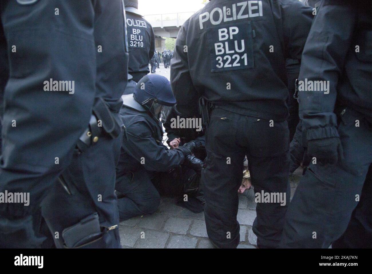 Policemen arrest a demonstrator during the clashes in the Kreuzberg district on May 1, 2016 in Berlin, Germany. May Day, or International Workers' Day, was established as a public holiday in Germany in 1933. Since 1987 May Day has also become known in Berlin for violent clashes between police and mostly left-wing demonstrators. (Photo by Emmanuele Contini/NurPhoto) *** Please Use Credit from Credit Field *** Stock Photo