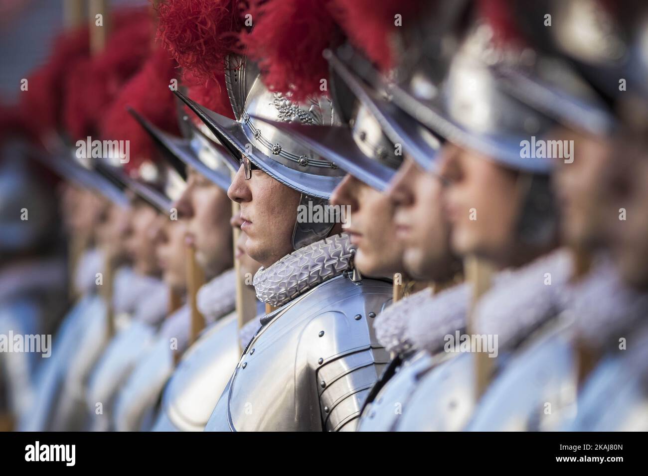 Swiss Guards take part in a swearing-in ceremony   in San Damaso Courtyard, Vatican on May 06, 2016. The annual swearing-in ceremony for the new papal Swiss Guards takes place on May 6, commemorating the 147 who died defending Pope Clement VII on the same day in 1527 during the sack of Rome.(Photo by Giuseppe Ciccia/NurPhoto) Stock Photo