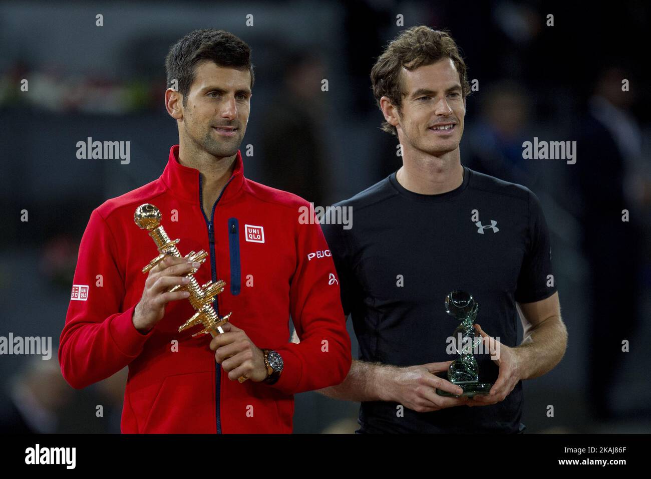 Novak Djokovic from Serbia (left) displays his trophy after winning the Madrid Open tennis tournament, men's final match against Andy Murray (right) from Great Britain  in Madrid, Spain, Sunday, May 8, 2016. Djokovic won 6-2, 3-6 and 6-3 (Photo by Rodrigo Garcia/NurPhoto) *** Please Use Credit from Credit Field *** Stock Photo