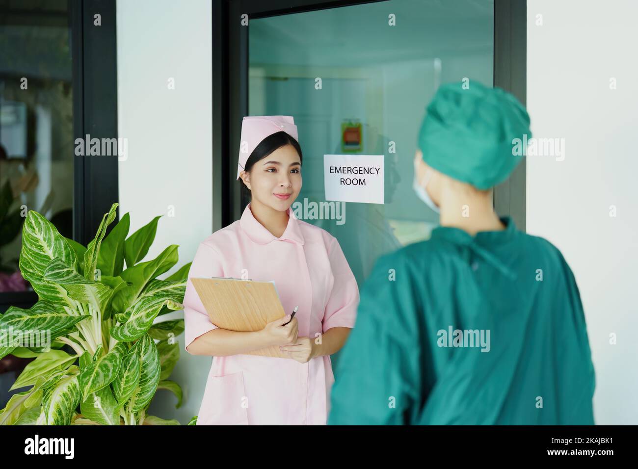 doctor and nurse talking before going into the operating room Stock
