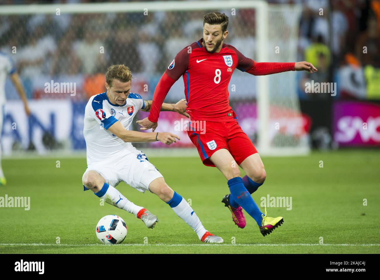 Ondrej Duda of Slovakia and Adam Lallana of England fight for the ball during the UEFA Euro 2016 Group B match between Slovakia and England at Stade Geoffroy Guichard in Saint-Etienne, France, June 20, 2016 (Photo by Andrew Surma/NurPhoto) *** Please Use Credit from Credit Field *** Stock Photo
