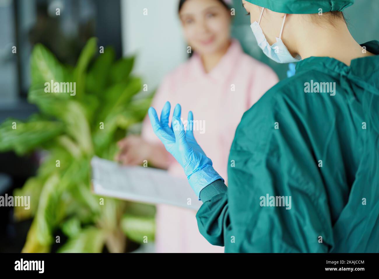 doctor and nurse talking before going into the operating room Stock