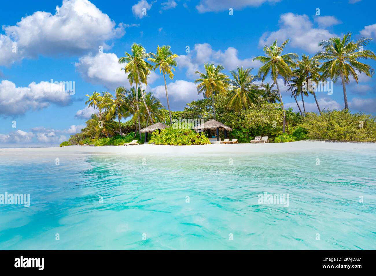 Beautiful palm trees on tropical island beach, blue sky with white ...