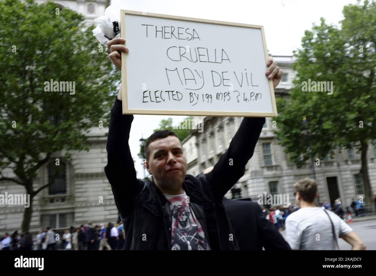 Crowds and protests around Downing street on 13 July 2016 in London, England as David Cameron leaves office for the last time and the new Prime Minister Theresa May enters Donning street. Protests included those who where against Conservative party budget cuts and also those calling for article 50 of the Lisbon treaty to be invoked immediately (Photo by Jay Shaw Baker/NurPhoto) *** Please Use Credit from Credit Field *** Stock Photo