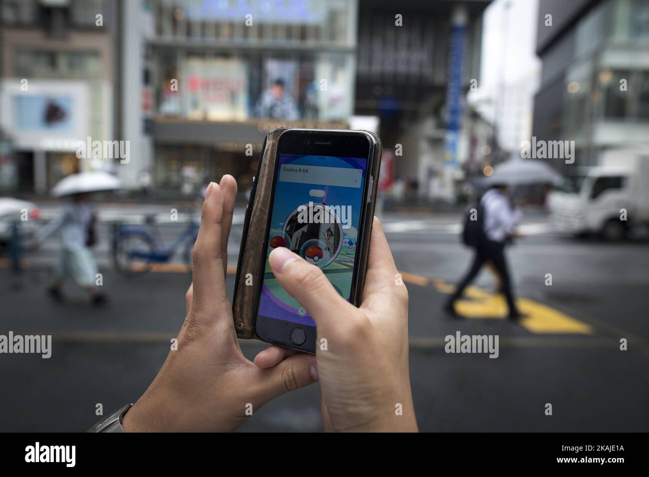 BANGKOK, Thailand - August 7, 2016: An IPhone User Playing Pokemon Go Game  In Supermarket Of Department Store And Find Pokemon Monster For Catching.  Free-to-play Augmented Reality Mobile Game Developed By Niantic.