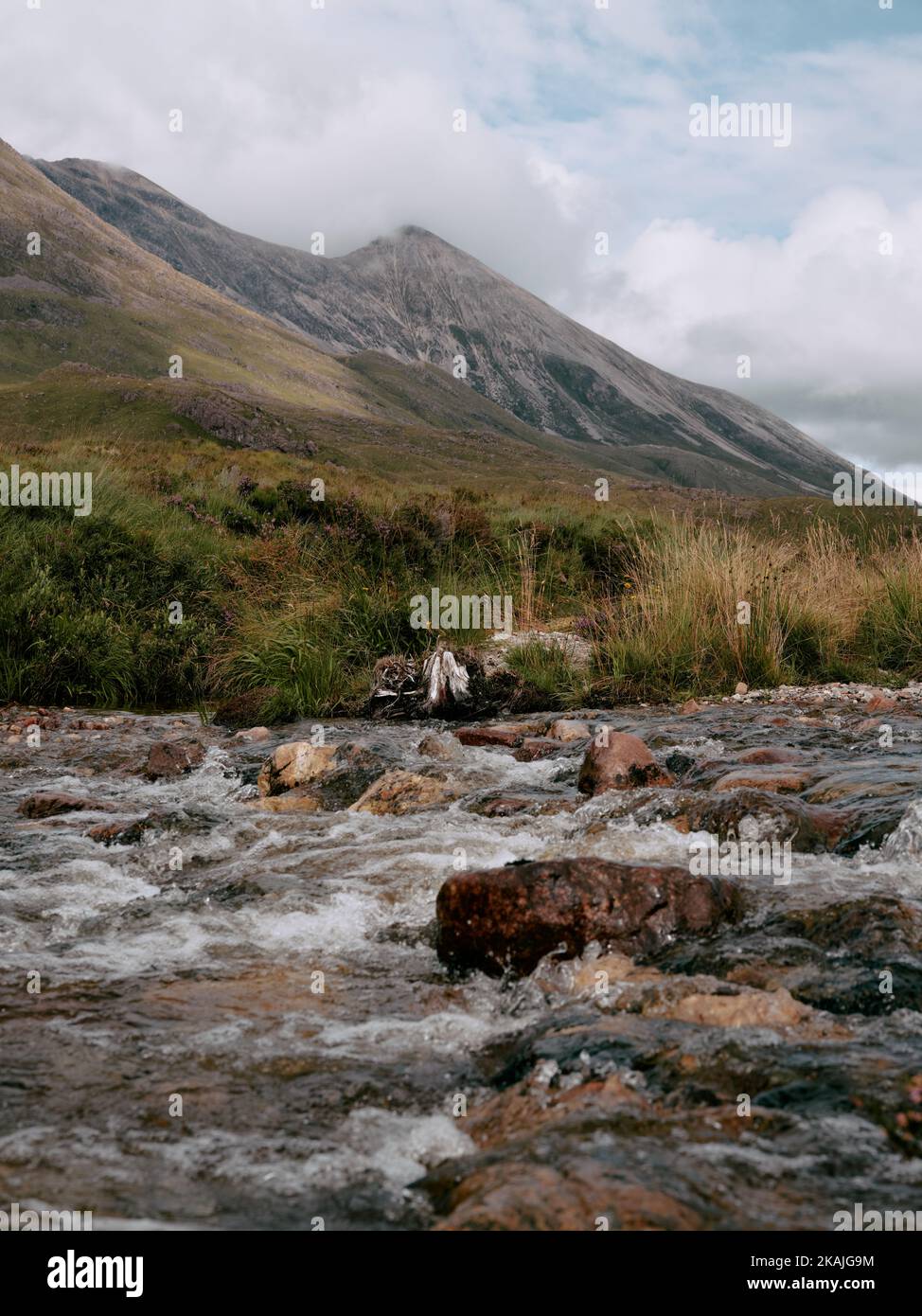 The river Allt Coire An Anmoich and the mountain landscape of Beinn Eighe in Torridon Wester Ross Scotland UK Stock Photo