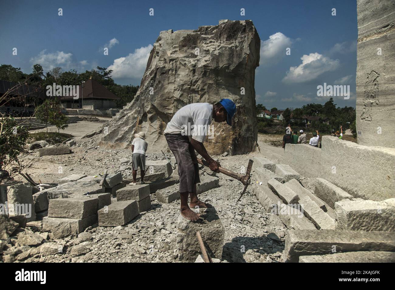A man breaking stone breccia in Sambirejo, Yogyakarta, Indonesia, on ...