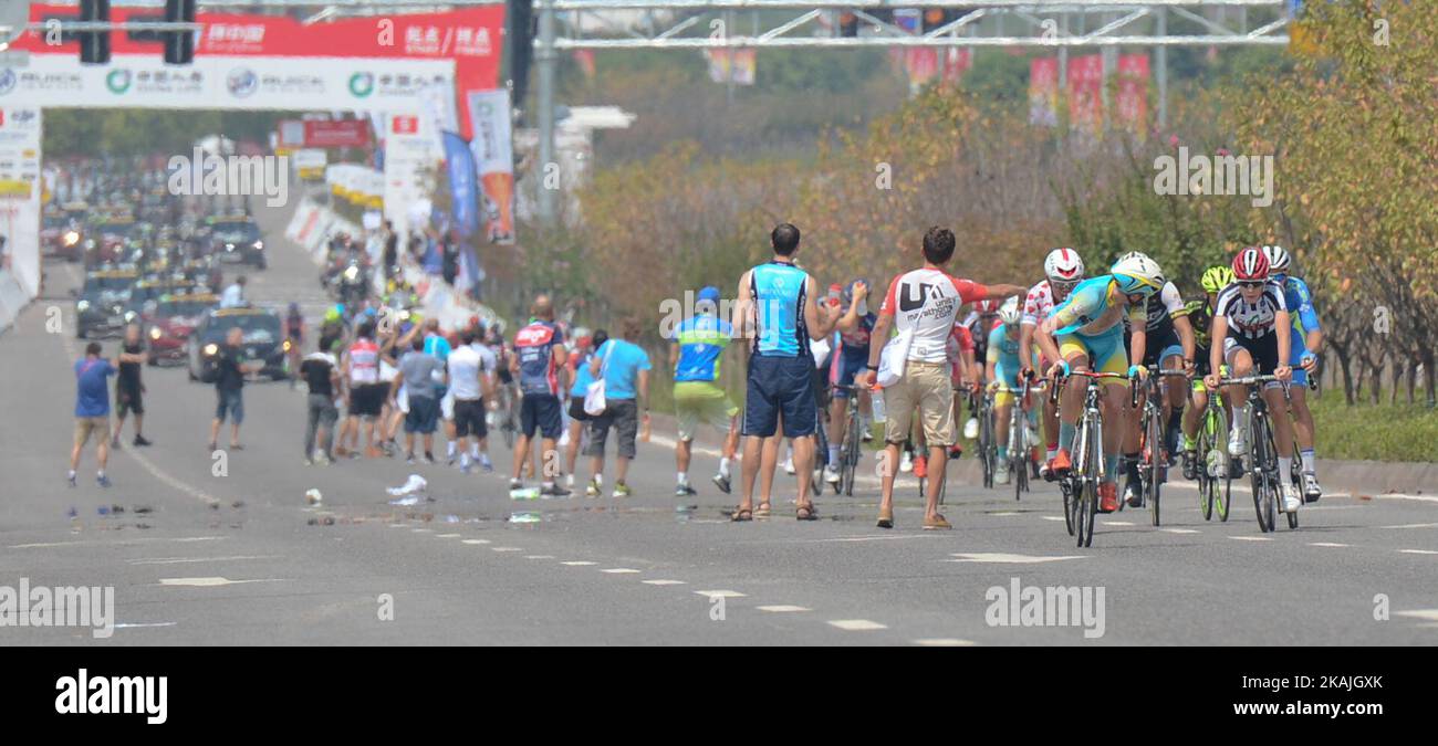 Riders pass by The Feed Zone during the third stage, 114.7 km Chongqing ...